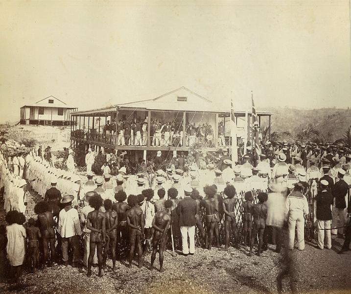HistPOM proclamation_of_annexation.jpg - Reading the proclamation of annexation, Mr Lawe's house, Port Moresby, New Guinea, November 1884 / photographer John Paine or Augustine E. Dyer (source: http://www.flickr.com/photos/statelibraryofnsw/5708761723/; 15.2.13)